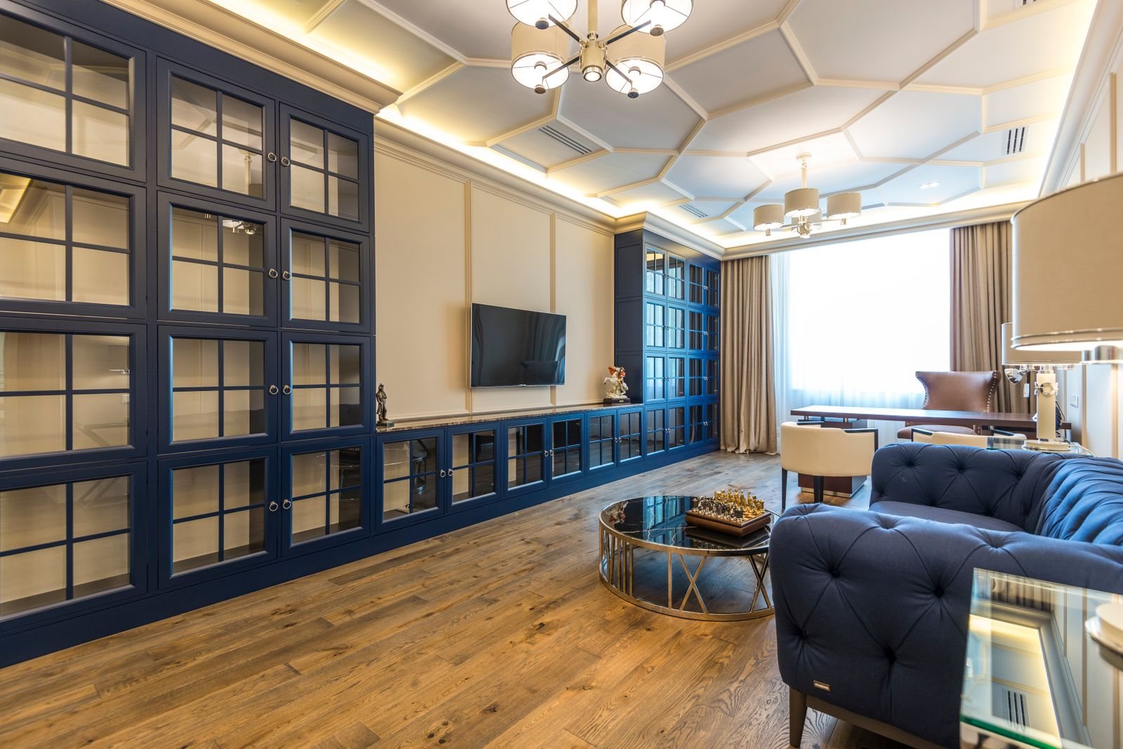 Render del living de un tres ambientes con comedor y ventanal.